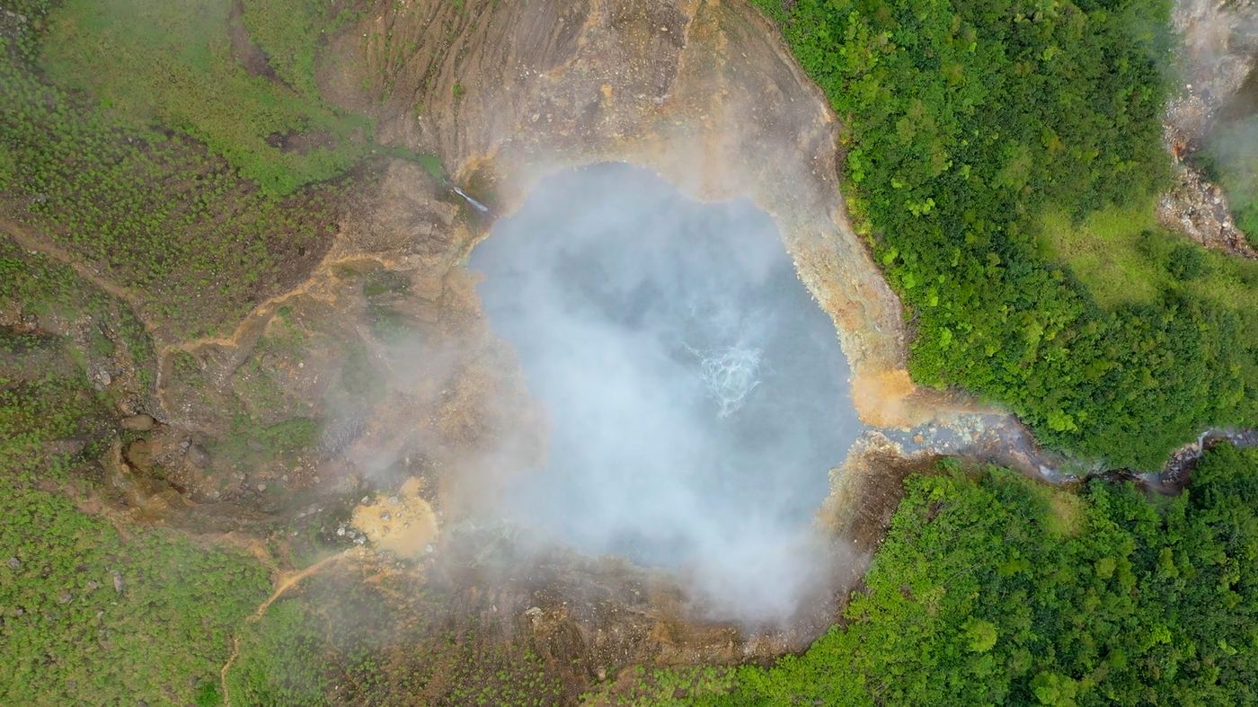 Aerial view of Boiling Lake steaming inside its volcanic crater