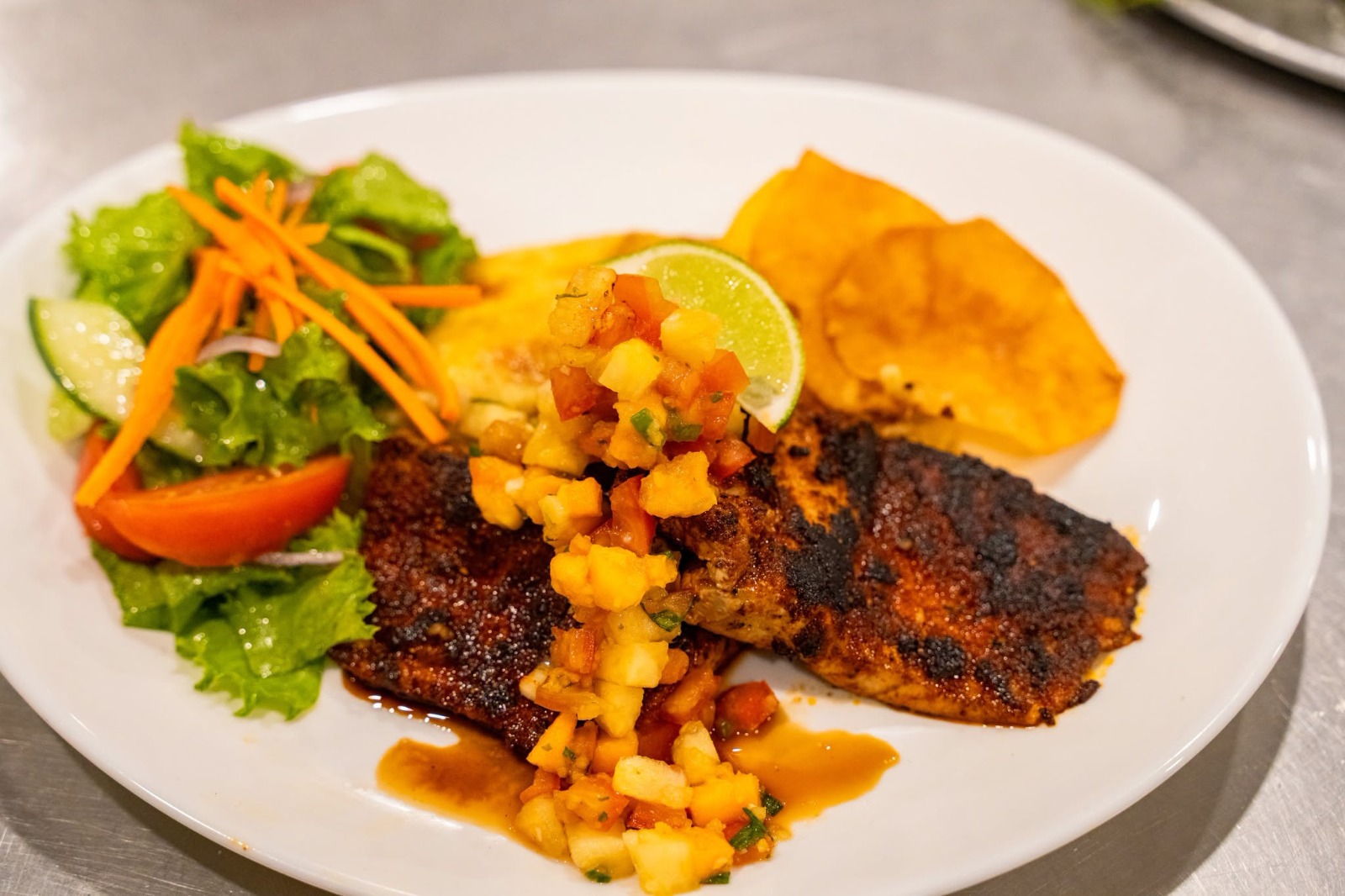 Creole plate of callaloo, grilled crayfish, green fig and saltfish