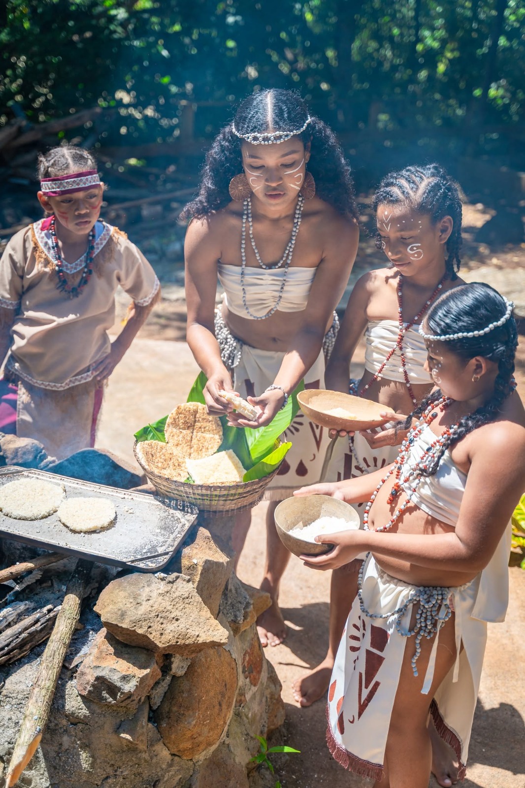 Women preparing cassava using traditional methods in Dominica