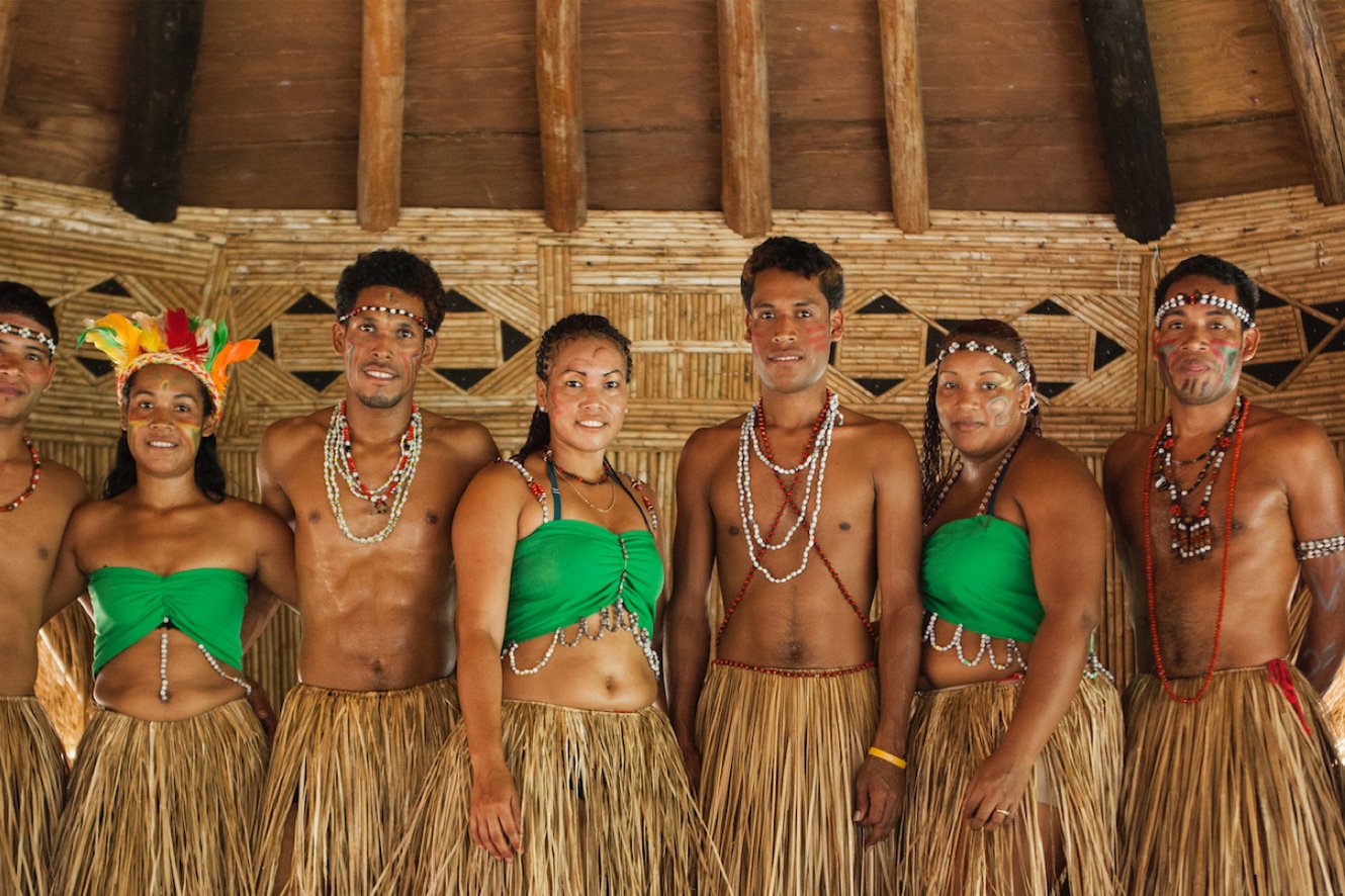 Kalinago craftsperson carving traditional patterns into wood